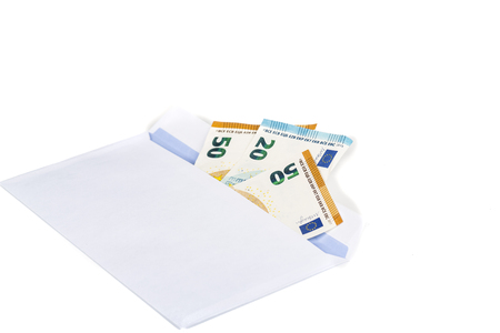 White envelope full of euro banknotes bills onwhite background. Concept of corruption, drug and bribery. Front and top viewの写真素材