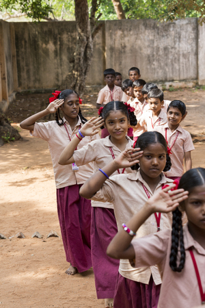 PONDICHERY, PUDUCHERY, INDIA - SSEPTEMBER 04, 2017. School parade of each monday morning, with children students in uniforms. They walk, sing and pray before going in the classrooms.のeditorial素材