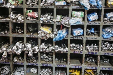 PONDICHERY, PUDUCHERY, TAMIL NADU, INDI1 - CIRCA SEPTEMBER 2017. Hardware store. Traditional showcase of tool store. Toolboxes and toolkit in the shop.のeditorial素材