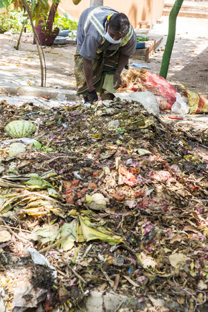 PUDUCHERY, PONDICHERY, TAMIL NADU, INDIA - March circa, 2018. Indian women are sorting waste in garbage dumps to recycle. With gloves ans masks for hygienicのeditorial素材