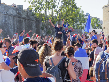 ST MALO, FRANCE - JULY 15, 2018. Unidentified French football fans supporters after the match of FIFA World Cup Russia 2018 France vs Croatia. France won 4-2. French are the world champion. People so happy, singing, yelling in the streetのeditorial素材