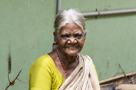 PONDICHERY, PUDUCHERRY, TAMIL NADU, INDIA - SEPTEMBER CIRCA, 2017. Portrait of an unidentified Indian old senior poor woman with saree in the street, looking serious sadのeditorial素材