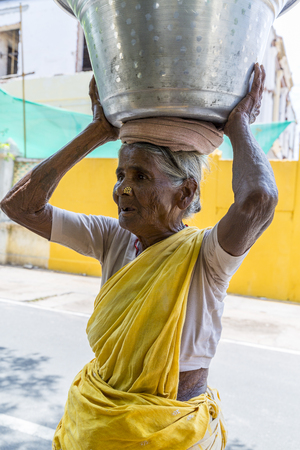 PONDICHERY, PUDUCHERRY, TAMIL NADU, INDIA - SEPTEMBER CIRCA, 2017. Portrait of an unidentified Indian old senior poor woman with saree in the street, looking serious sadのeditorial素材