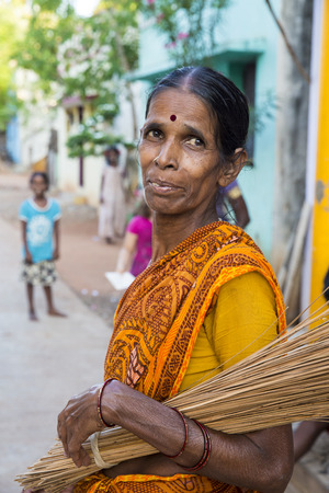 PONDICHERY, PUDUCHERRY, TAMIL NADU, INDIA - SEPTEMBER CIRCA, 2017. Portrait of an unidentified Indian old senior poor woman with saree in the street, looking serious sadのeditorial素材