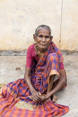 PONDICHERY, PUDUCHERRY, TAMIL NADU, INDIA - SEPTEMBER CIRCA, 2017. Portrait of an unidentified Indian old senior poor thin woman with saree in the street, looking serious sadのeditorial素材