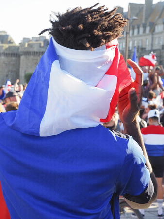 ST MALO, FRANCE - JULY 15, 2018. Unidentified French football fans supporters after the match of FIFA World Cup Russia 2018 France vs Croatia. France won 4-2. French are the world champion. People so happy, singing, yelling in the streetのeditorial素材