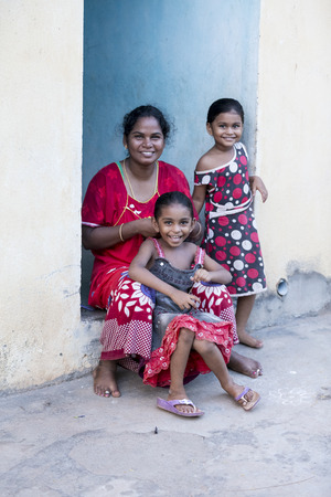 PONDICHERY, PUDUCHERRY, TAMIL NADU, INDIA - SEPTEMBER CIRCA, 2017. Portrait of a unidentified happy woman with children outdoorsのeditorial素材
