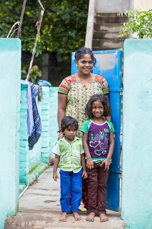 PONDICHERRY, PUDUCHERRY, TAMIL NADU, INDIA - March Circa, 2018. Unidentified poor child with mother in the street of villageのeditorial素材