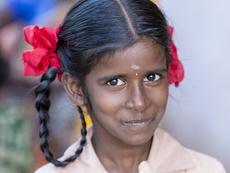PONDICHERY, PUDUCHERRY, TAMIL NADU, INDIA - SEPTEMBER Circa, 2017. An unidentified poor girl in a small village, outdoor, looking at the cameraのeditorial素材