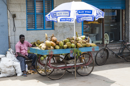 PONDICHERY, PUDUCHERRY, TAMIL NADU, INDIA - SEPTEMBER CIRCA, 2017. Different scenes of Indian street vendor with fresh vegetables and fruits along the road.のeditorial素材