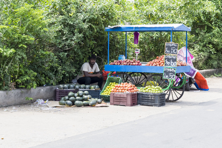 PONDICHERY, PUDUCHERRY, TAMIL NADU, INDIA - SEPTEMBER CIRCA, 2017. Different scenes of Indian street vendor with fresh vegetables and fruits along the road.のeditorial素材