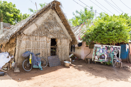 PONDICHERY, PUDUCHERRY, TAMIL NADU, INDIA - SEPTEMBER CIRCA, 2017. Unidentified rural people in front of their house at village, An Indian rural scene.のeditorial素材