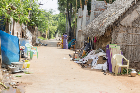 PONDICHERY, PUDUCHERRY, TAMIL NADU, INDIA - SEPTEMBER CIRCA, 2017. Unidentified rural people in front of their house at village, An Indian rural scene.のeditorial素材