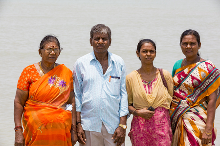 Group of unidentified family woman man child with colored colorful sari and cloths. Happy to be taken pictures.のeditorial素材