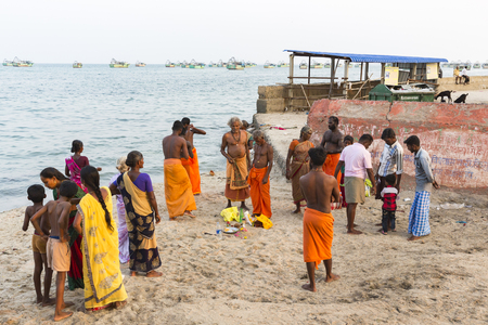 RAMESHWARAM, TAMIL NADU, INDIA- MARCH CIRCA 2018. At the gate, Unidentified Hindu pilgrims people ready to go to the bath in the Arabian Sea before entering the temple. Great time of all the familiesのeditorial素材