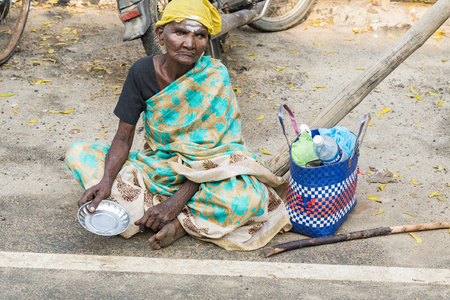 RAMESHWARAM, TAMIL NADU, INDIA - MARCH CIRCA, 2018. Portrait of an unidentified homeless woman in the street of the sacred city of Rameshwaram, India.のeditorial素材