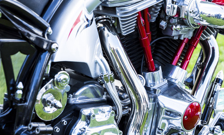 EVREUX, FRANCE - SEPTEMBER 16, 2018. Cropped image of new shiny motorcycle motorbike engine. Biker...