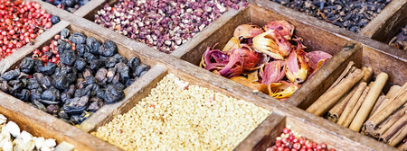 Collection multicolored mosaic spices assortment in wooden box organizer. Food cooking ingredient from all over the world indian asian for cooking oriental food. Banner size.の写真素材
