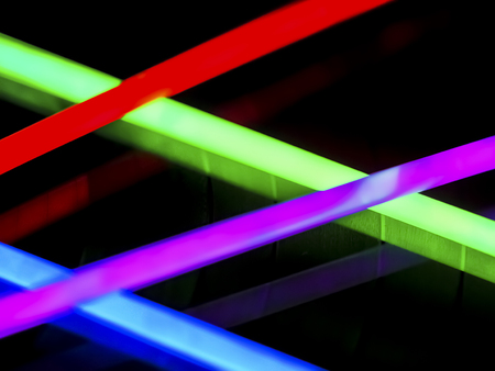 Variation of multicolored colorful colored fluorescent chem light neon tube with reflection on...
