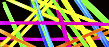 Variation of multicolored colorful colored fluorescent chem light neon tube with reflection on...