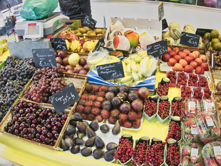 St Vaast, France - December circa, 2018. Exotic fruits. Market stall with variety of organic fruits....