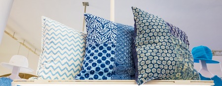 Rows of decorative fashion casual white blue grey pillows cushions