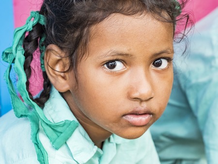 PUDUCHERRY, INDIA - DECEMBER Circa, 2018. Unidentified poor indian girl portrait looking serious...