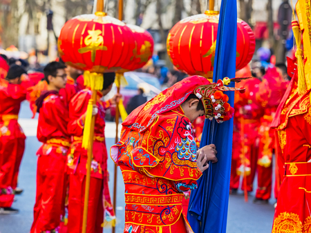 PARIS, FRANCE - FEBRUARY 17, 2019. Last day of the chinese new year celebration festival in street. People show walking with colorful costumes and decorations. 200 thousands, multi ethnic asian man woman. Year of pigのeditorial素材