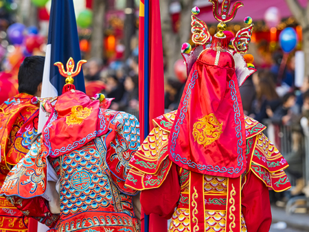 PARIS, FRANCE - FEBRUARY 17, 2019. Last day of the chinese new year celebration festival in street. People show walking with colorful costumes and decorations. 200 thousands, multi ethnic asian man woman. Year of pigのeditorial素材