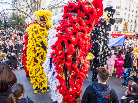 PARIS, FRANCE - FEBRUARY 17, 2019. Last day of the chinese new year celebration festival in street. People dragon lion dancing show colorful costumes. 200 thousands, multi ethnic asian man woman. Year of pigのeditorial素材