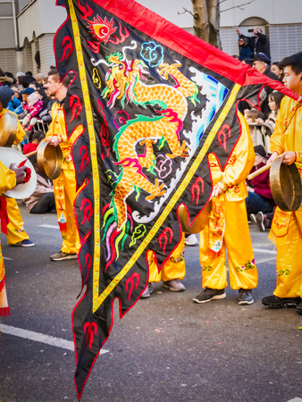 PARIS, FRANCE - FEBRUARY 17, 2019. Last day of the chinese new year celebration festival in street. Lanterns flags red decorations ornaments in the street during the parade festivalのeditorial素材