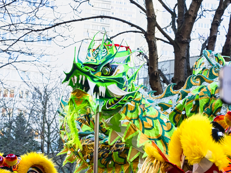 PARIS, FRANCE - FEBRUARY 17, 2019. Last day of the chinese new year celebration festival in street. Dance of colorful green dragons in the street during the parade festival. Traditional celebration.のeditorial素材