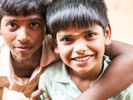 PUDUCHERRY, INDIA - DECEMBER Circa, 2018. Unidentified best children indian boys friends smiling standing with hand on shoulder enjoying friendship.のeditorial素材
