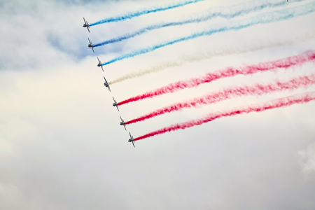 LE BOURGET, FRANCE - June 24, 2017. Flying display and aerobatics show in the sky with red blue...