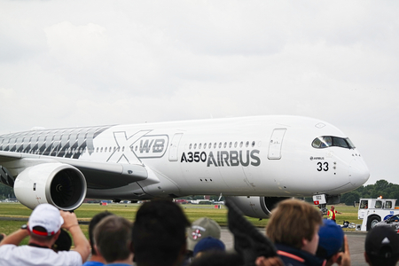 LE BOURGET, FRANCE - JUNE 24, 2017. Aircrafts parked at meeting space in Paris Le Bourget during the Aeronautics and spatial international airshow and aviation exhibition, with crowd peole looking airforce flight.のeditorial素材
