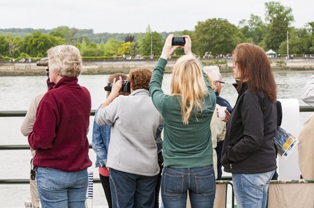 YAINVILLE, FRANCE - JULY Circa 2016. Big village picnic for the Aramada parade exhibition, along the river Seine. Pepole waiting for the boats ships.のeditorial素材
