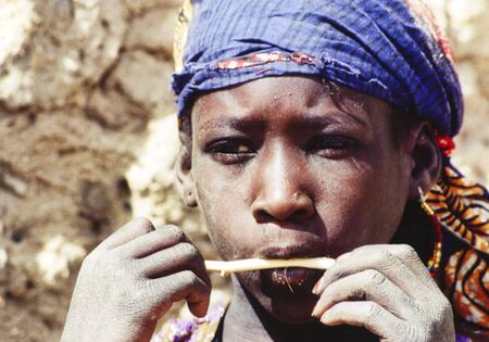 TIMBUKTU, MALI - FEBRUARY Circa, 2019. Unidentified poor african children boys shy and curious to see tourists. Dressed with colorful traditional clothesのeditorial素材