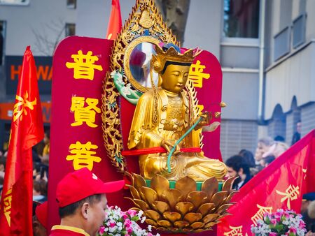 PARIS, FRANCE - FEBRUARY 17, 2019. Last day of the chinese new year celebration festival in street. Buddha statue outdoor for people praying and wishing a happy new year. Traditional customのeditorial素材
