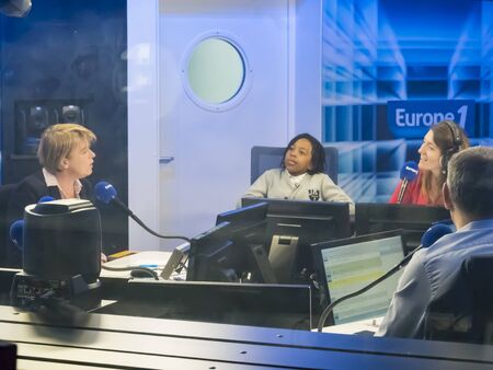 PARIS, FRANCE - NOVEMBER Circa, 2019. EUROPE 1 live radio show in studio seen through window, so highlights, the station is the most heard radio station in France.のeditorial素材