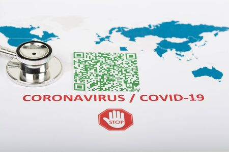 World map with green colorful illegible QR Code for coronavirus Covid-19 infection used in company for workers to know about their health virus infection.の写真素材