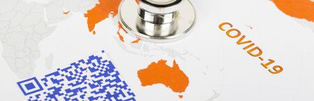 World map with blue colorful illegible QR Code for coronavirus Covid-19 infection used in company for workers to know about their health virus infection.の写真素材