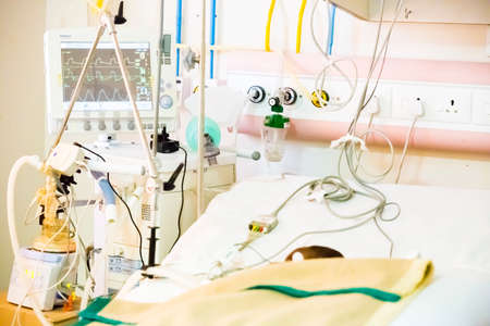 PUDUCHERRY, INDIA - MARCH Circa, 2020. Baby on big bed placed on an artificial lung ventilation equipment in indian hospital. Pneumonia diagnosting. COVID-19 and coronavirus identificationのeditorial素材