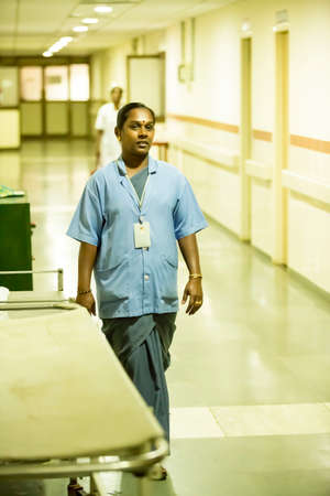 PUDUCHERRY, INDIA - MARCH Circa, 2020. Doctor without face mask in hospital hallway, Healthcare workers in the Coronavirus Covid19 pandemicのeditorial素材