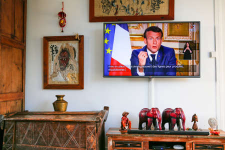 PARIS, FRANCE - APRIL 12, 2020. Emmanuel Macron, President, talking live at TV to french people, announcing the extension of lockdown until may 11 to contain Covid, and plan to use vaccine, test and treatment before going out.のeditorial素材