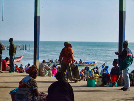 SENEGAL, AFRICA - MARSCH Circa, 2016. Scene of M'Bour great fish market on the beach. People waiting...
