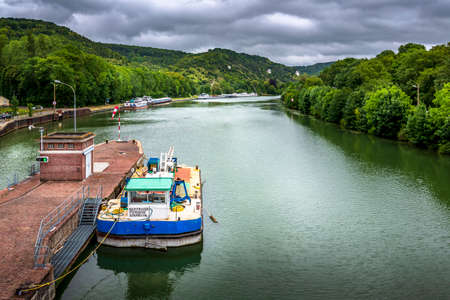 ROUEN, FRANCE - June 14, 2020. Large view by wide angle on Seine River in France, with houseboats on...