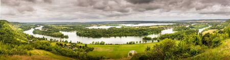 Large view by wide angle on the Seine River close to Rouen in France. Good lights, cloudy sky....