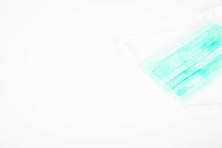 Surgeon medical mask on white background, against covid contagion to stop virus, world disease