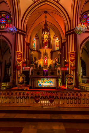 Interior of decorative church by night. Nice vibrant stained glass windows and beautiful light...