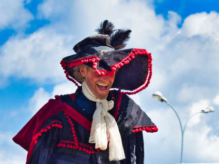 YAINVILLE, FRANCE - JULY Circa, 2019. Actor man in historical pirate costume making a show outdoors,...